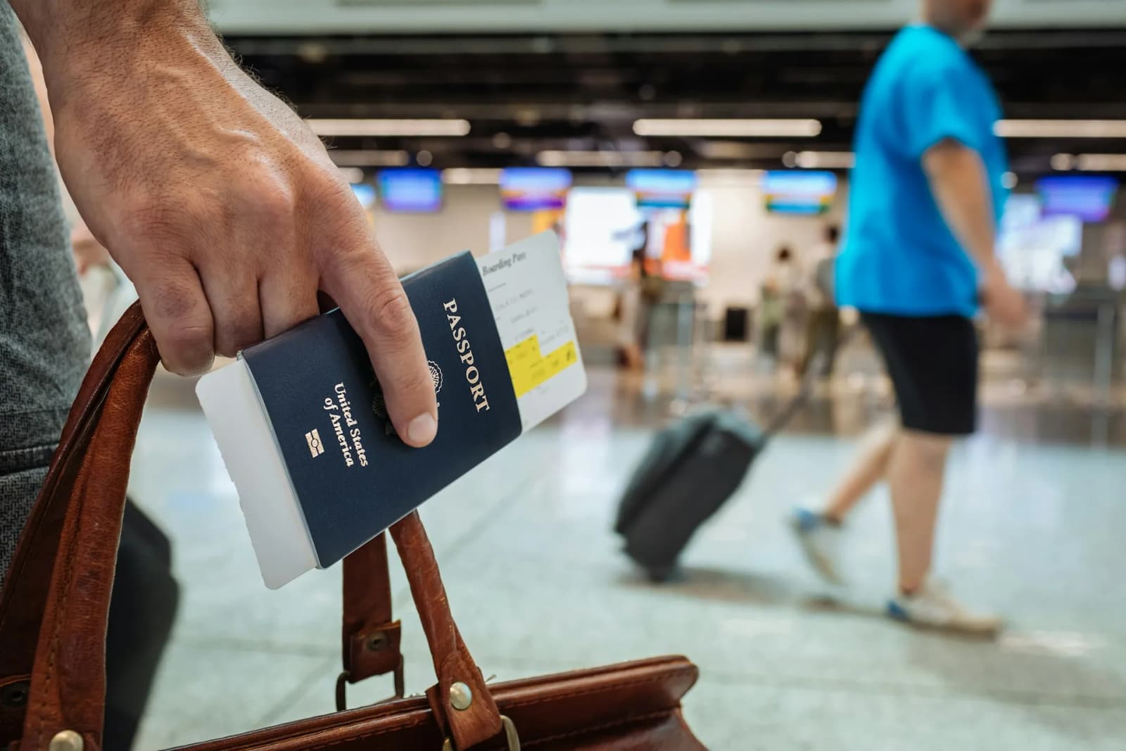 Traveller holding passport at airport